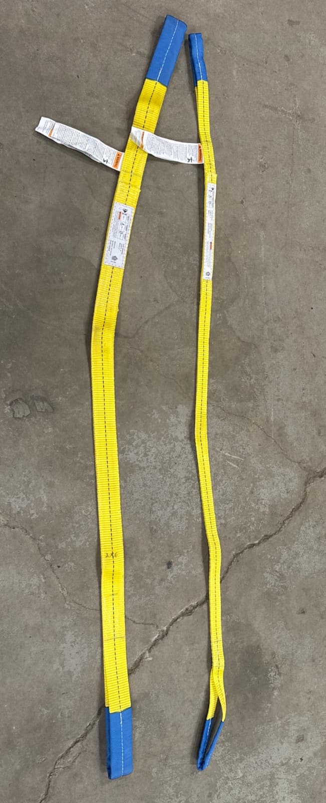 Yellow nylon lifting straps, eye to eye, with rated capacity tags