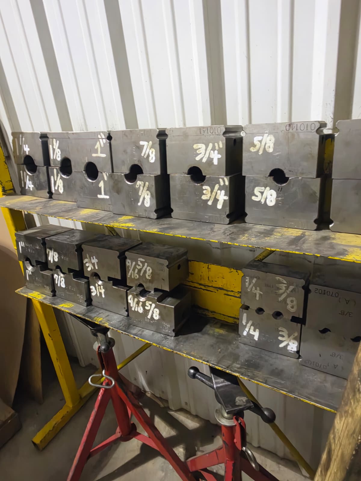 Racked swage dies and parts by size at Zia Wire Rope